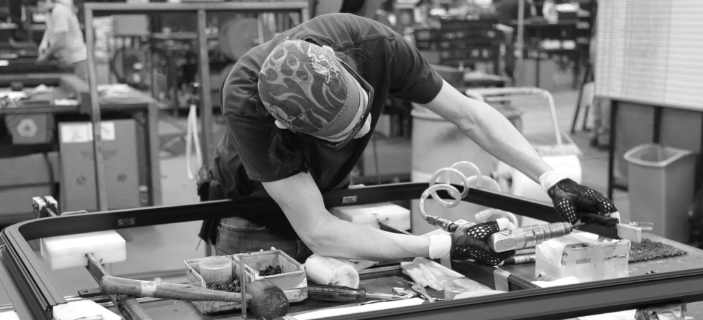 Photo of AROW worker assembling window