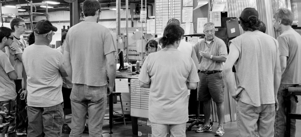 Employees at AROW in a group meeting